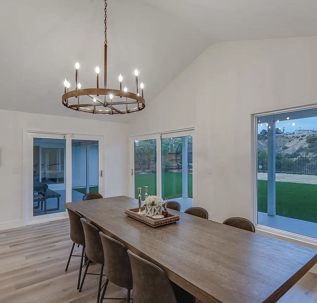 Dining room alternate view — sliding doors to backyard, wide-plank floors