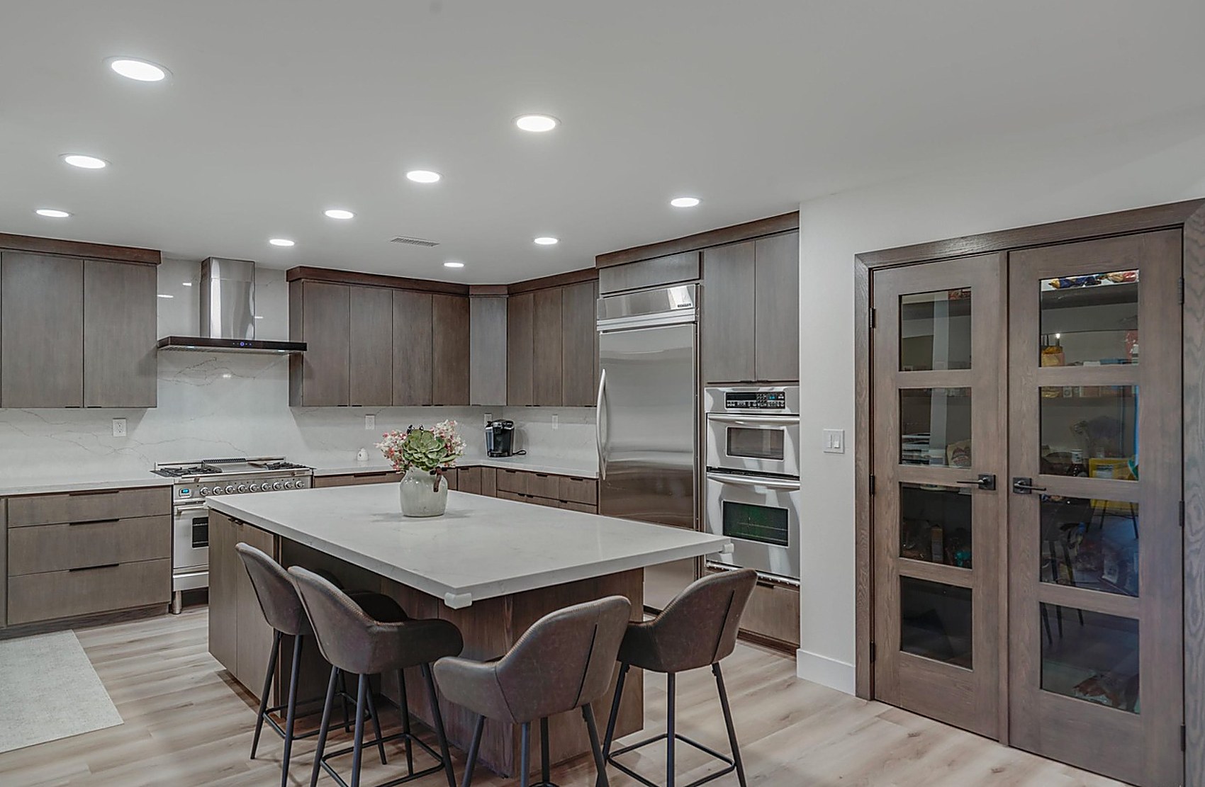 Kitchen island detail with stained walnut cabinetry