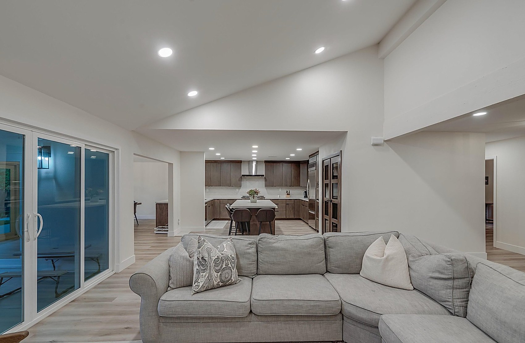 Living room finished — open to kitchen with sliding doors