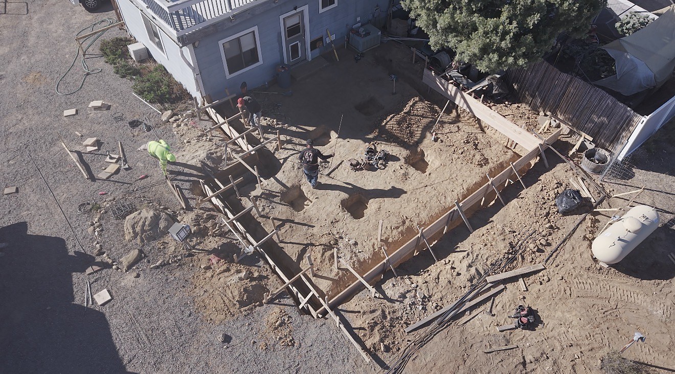 Concrete forms set with crew prepping for the pour