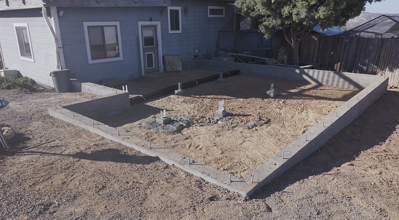 Foundation poured with anchor bolts and pier pads ready for framing