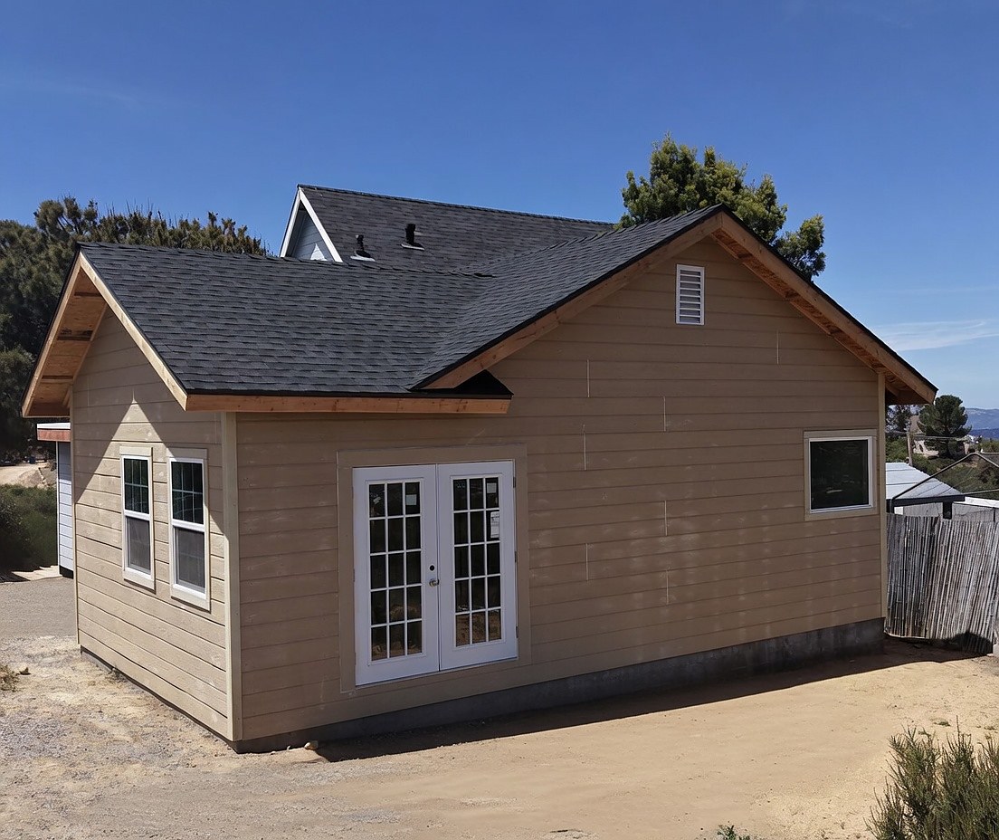 Corner view showing siding, roofline, and trim detail