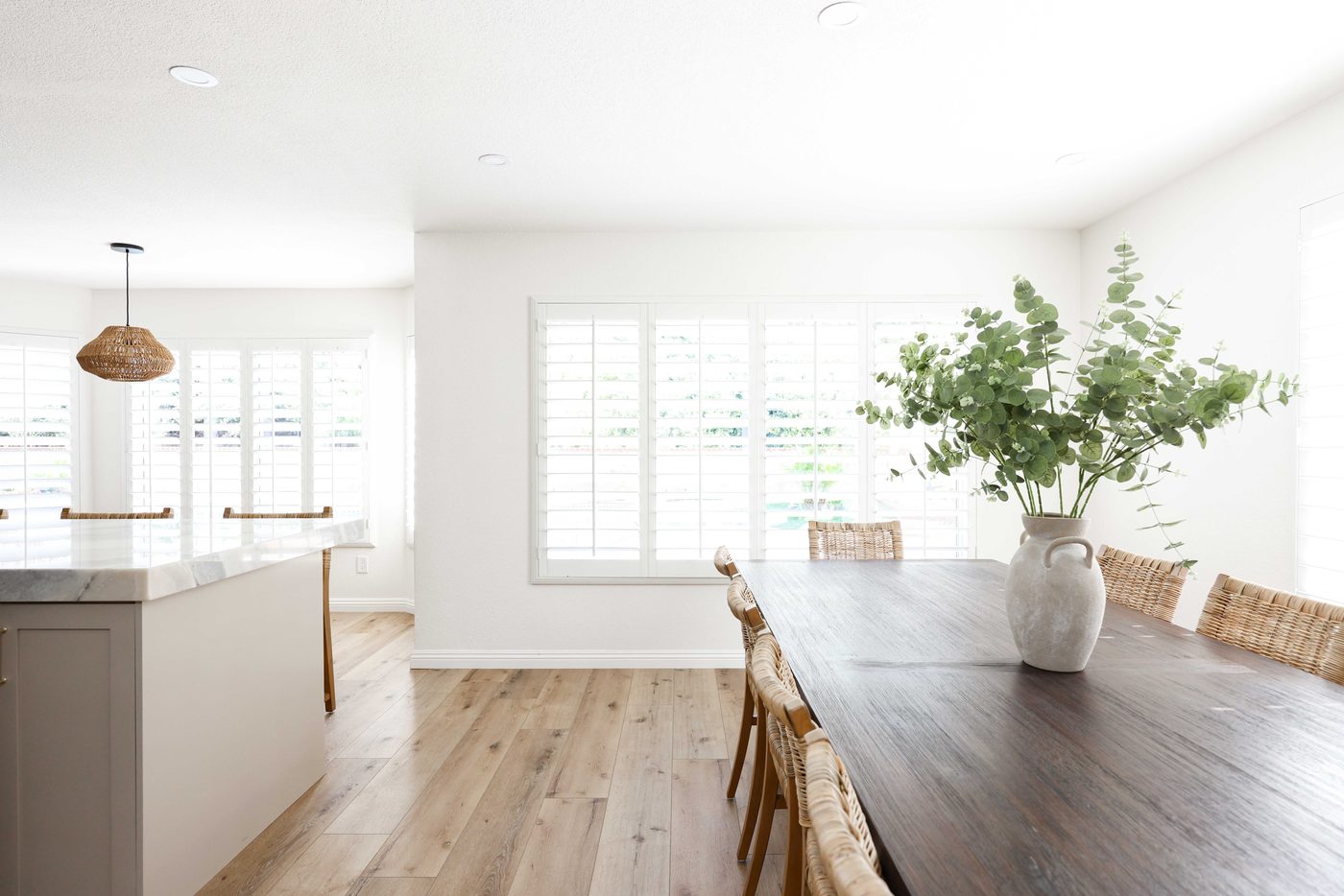 Dining nook with eucalyptus and plantation shutters