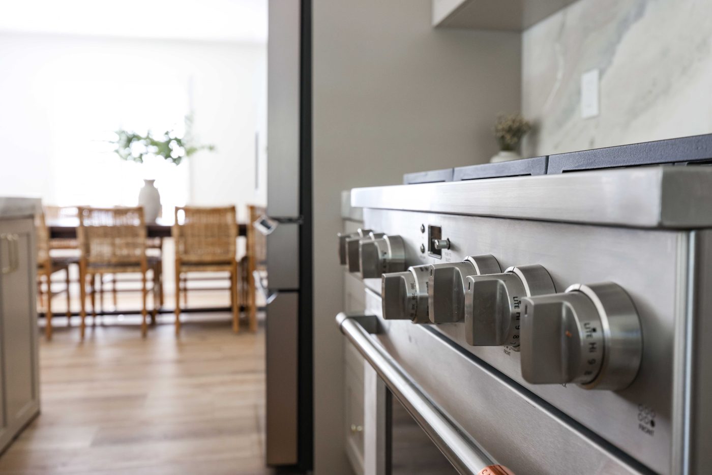 Gas range detail with marble backsplash