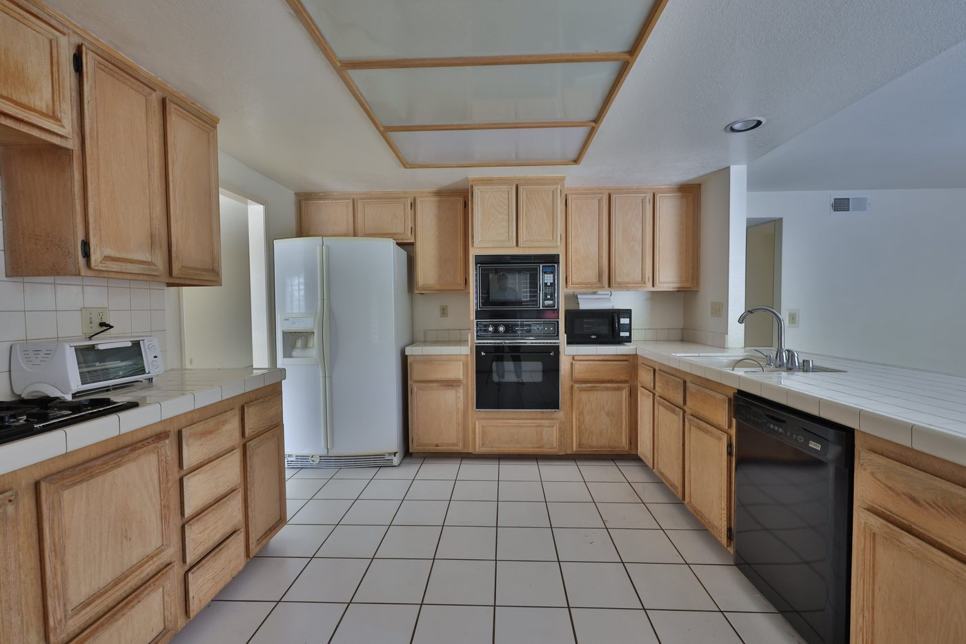 Kitchen before — closed-off galley layout